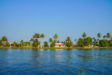 River Side View With Coconut Tree And House In Alleppey. Kerala 