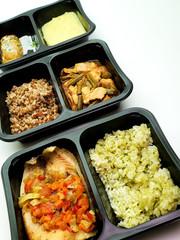 Plastic containers with delicious food on an isolated background. Delivery service.