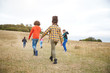 © Monkey Business - Rear View Of Group Of Children On Outdoor Activity Camping Trip Walking Up Hill