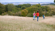 © Monkey Business - Rear View Of Group Of Children On Outdoor Activity Camping Trip Running Down Hill
