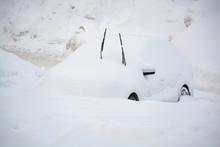 Car Buried Under A Thick Layer Of Snow After Snow Storm