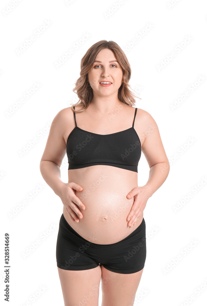 Beautiful pregnant woman on white background