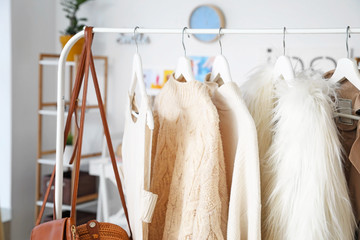 Poster - Rack with stylish female clothes in dressing room