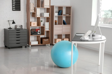 Wall Mural - Fitness ball near workplace in office