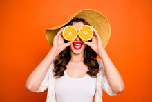 Photo Of Cheerful Positive Casual Cute Nice Pretty Sweet Curly Wavy Gorgeous Girlfriend Excited About Sights Opened When Looking Through Two Lemons Isolated Over Vivid Orange Color Background