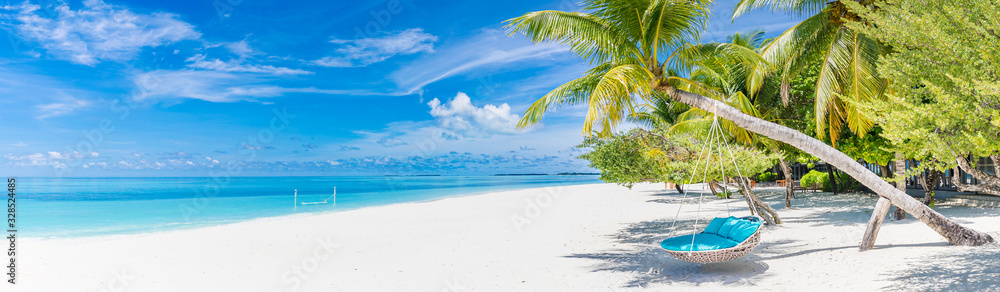Tropical beach panorama as summer landscape with beach swing or hammock and white sand and calm sea for beach banner. Perfect beach scene vacation and summer holiday concept. Boost up color process - obrazy, fototapety, plakaty 