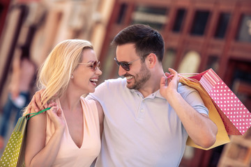 Poster - Young couple in shopping