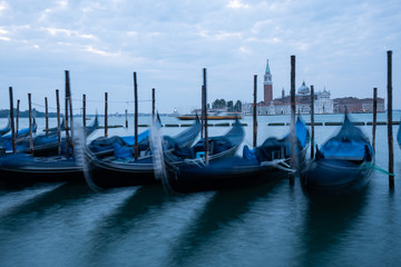 Wall Mural - Gondolas moored by Saint Mark square with San Giorgio di Maggiore church in Venice, Italy