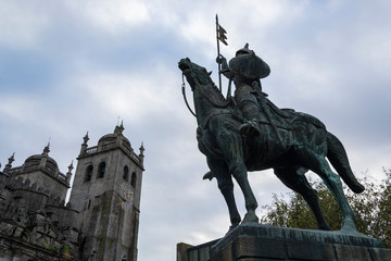 Warrior statue and cathedral of Porto in the background. Vímara Peres warrior. Porto.