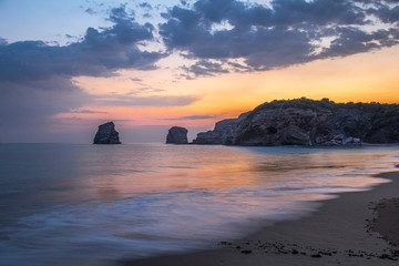 Wall Mural - First lights of the beautiful sunrise in winter in Hendaye near the water. France