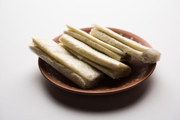 Sticker - Pootharekulu  is a popular recipe originated from Andhra Pradesh, India.It is a paper-thin sweet or dessert made from rice start/gram flour, jaggery/sugar and clarified butter. Served in a plate.