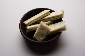 Sticker - Pootharekulu  is a popular recipe originated from Andhra Pradesh, India.It is a paper-thin sweet or dessert made from rice start/gram flour, jaggery/sugar and clarified butter. Served in a plate.