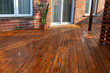 © Viktorus - Backyard wooden deck floor boards with fresh brown stain