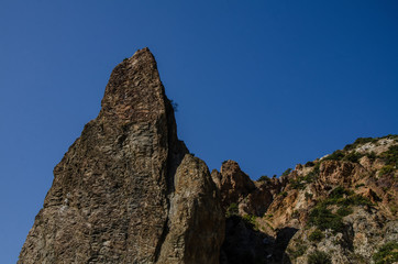 Sharp rock against the blue sky.