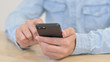 © stockbakers - Text Messaging onSmartphone by Man