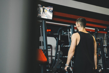 handsome bearded guy training in a gym