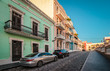 Cobblestone street with colorful houses in Old San Juan, Puerto Rico.