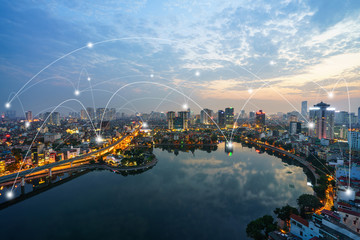 Smart city and wireless communication network concept. Digital network connection lines of Hanoi at Hoang Cau lake