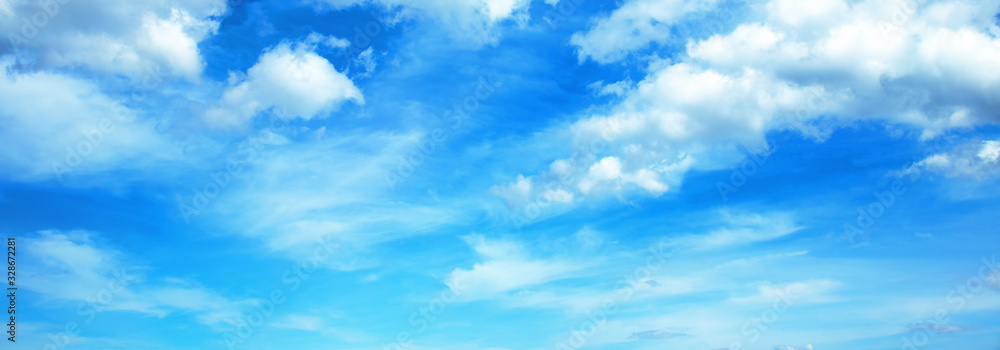 Sunny background, blue sky with white cumulus clouds  - obrazy, fototapety, plakaty 