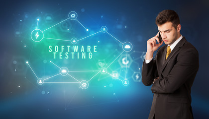 Businessman in front of cloud service icons with SOFTWARE TESTING inscription, modern technology concept