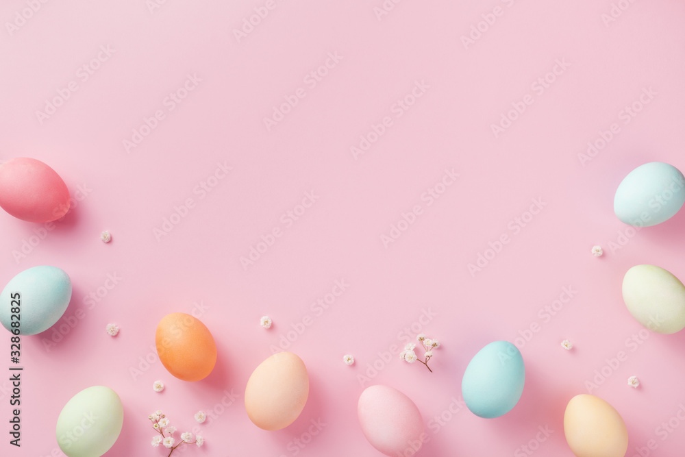 Pastel Easter eggs on pink background top view. Flat lay style. - obrazy, fototapety, plakaty 