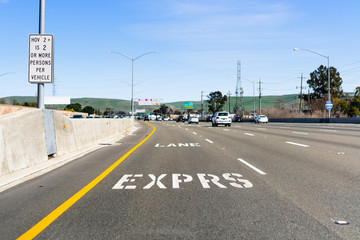 Express Lane marking on the freeway; San Francisco Bay Area, California; Express lanes help manage lane capacity by allowing single occupancy vehicles to use them for a fee