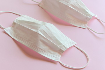 medical hygiene face mask on pink background