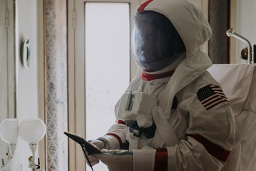 Wall Mural - astronaut coming back on earth after long time it s been abandoned. concept about science and scifi