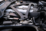 Fototapeta  - Modern Luxury Car V12 Engine Under Hood Closeup.