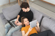 © Proxima Studio - Couple using home internet with mobile devices