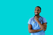 © Carlos David - Portrait of a smiling male doctor or nurse thinking and looking to side at copy space