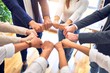 © Krakenimages.com - Group of business workers standing bumping fists at the office