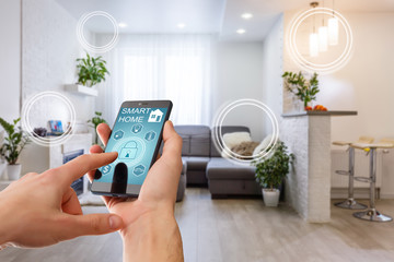 smart home technology interface on smartphone app screen with augmented reality (ar) view of interne