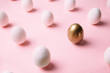 White Chicken Eggs Nicely Arranged In Creative Pattern On Pastel Pink Background. Creative Ester Holiday Concept.