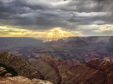 Crepuscular Light Rays At Sunset With Sunbeams Into The Grand Canyon, As Seen From Navajo Point.  Grand Canyon National Park, UNESCO World Heritage Site, Arizona
