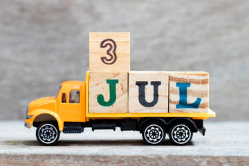 Sticker - Truck hold letter block in word 3jul on wood background (Concept for date 3 month July)