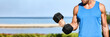© Maridav - Fitness exercise fit man training muscles at gym doing bicep curls with free weight dumbbell panoramic banner background.