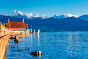 Wall Mural - Lake Zurich in Switzerland. Famous picturesque landscape of Zurich lake at Alpine mountains background in blue tones. Fascinating sunset scenery.