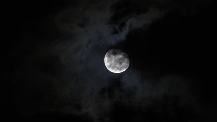 Wall Mural - full moon moving between clouds, 4k