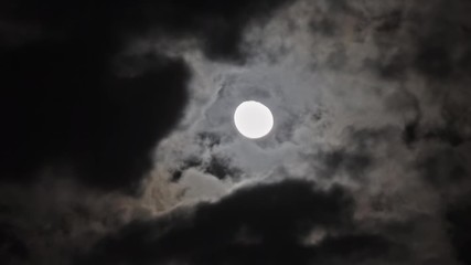 Wall Mural - full moon moving between clouds, timelapse