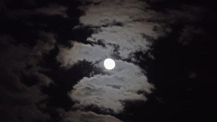 Wall Mural - full moon moving between clouds, timelapse, 4k