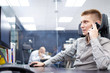 © Anton Gepolov - Young manager working in office. Internship in call center. HR department. Manager is calling.