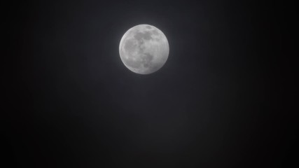 Wall Mural - full moon moving between clouds, 4k