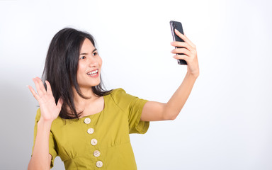 Wall Mural - young woman standing her taking selfie