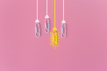 Great ideas concept with paperclip,thinking,creativity,light bulb on blue background,new ideas concept.