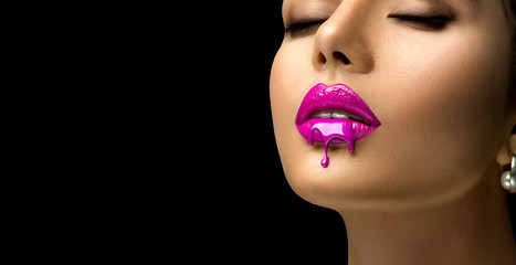 Poster - Pink Lipstick dripping. Paint drops on red lips, lipgloss dripping from sexy lips, Purple liquid drops on beautiful model girl's mouth, creative abstract make-up. Beauty woman face makeup close up