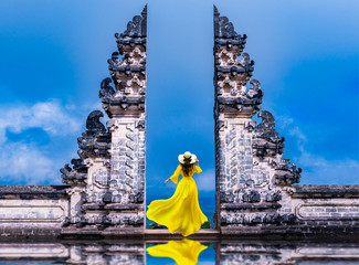 Asian woman standing  at Lempuyang Luhur temple in Bali, Indonesia.