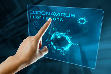 a woman's finger click information on the corona virus on a digital screen