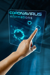 a woman's finger click information on the corona virus on a digital screen