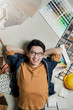 © whyframeshot - smart happiness asian man house owner laydown on floor with house material sample frame around home renovation ideas concept